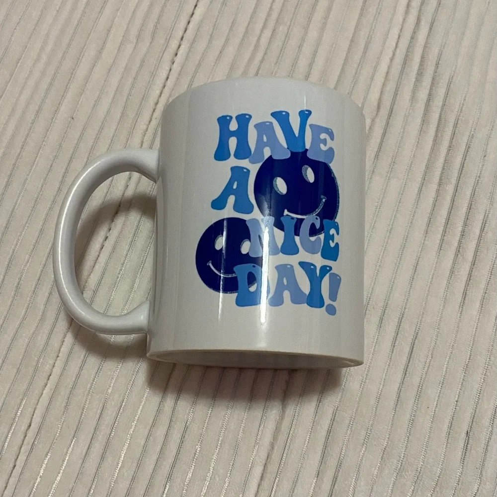 White and blue smiley face mug